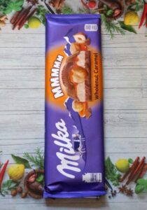 Шоколад Milka Wholenut Caramel постер